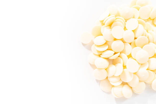 istock White round chocolate chips for melting chocolate shapes 1195156597