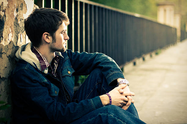istock Guy sitting near the fence 119516412