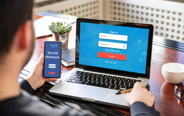 internet security concept. login password on laptop and smartphone screens - facebook social gathering log on communication imagens e fotografias de stock