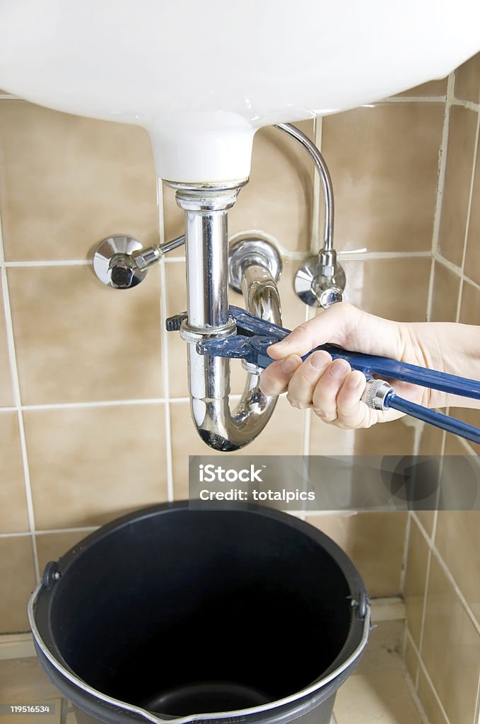 plumber hand  Adjustable Wrench Stock Photo