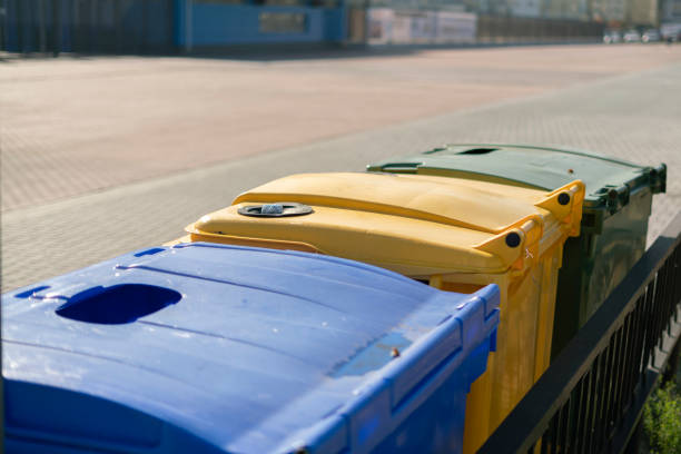 istock sorting the garbage waste, three color trash urns in the city, recycling 1195166220