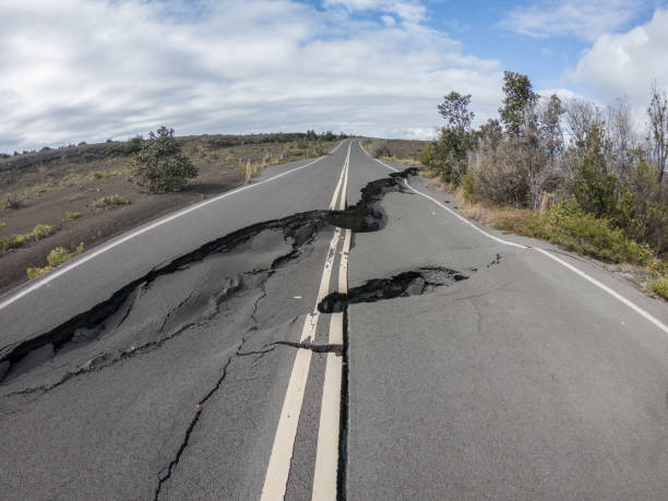 istock Cracked road from volcano activity in Volcano national park, Hawaii 1195168242