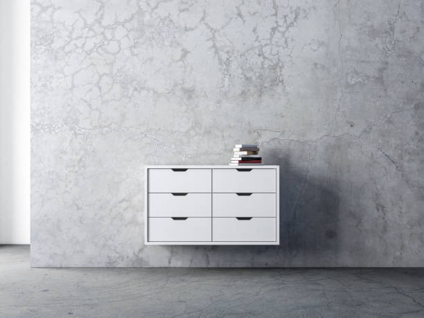 istock White bureau mockup in empty living room with concrete wall 1195168502