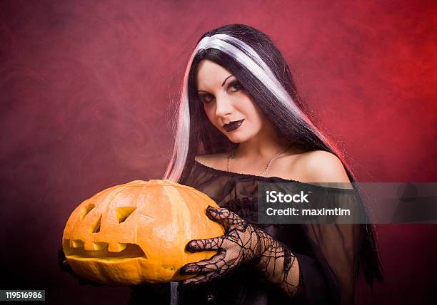 Halloween Witch With A Pumpkin Stock Photo - Download Image Now - Adult, Adults Only, Autumn