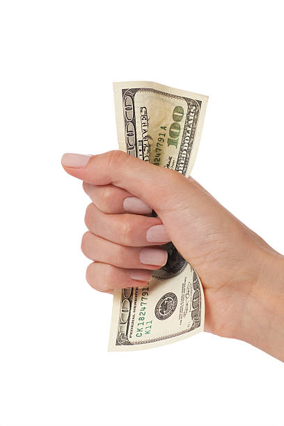 istock woman hand squeezing hundred dollars 119517249