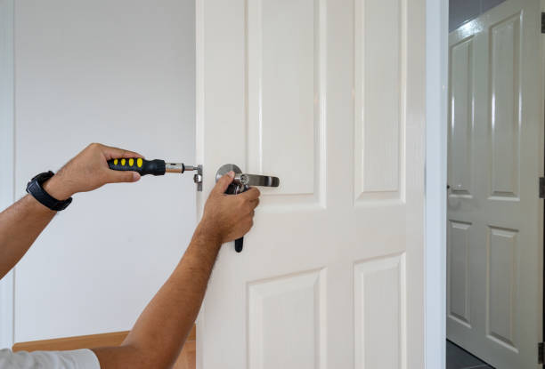 istock locksmith fix handle by screwdriver on white wood door - can use to display or montage on product 1195177565