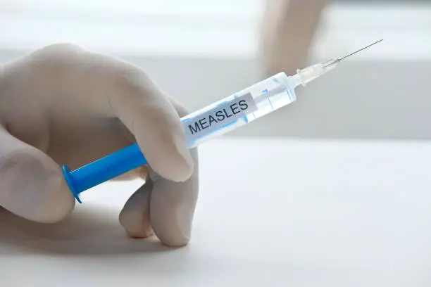 Health concept: Syringe for measles vaccination