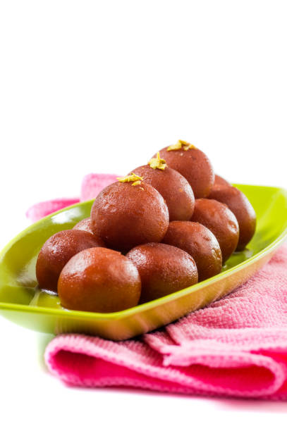 istock Indian Dessert Gulab Jamun in plate isolated on white background 1195180481