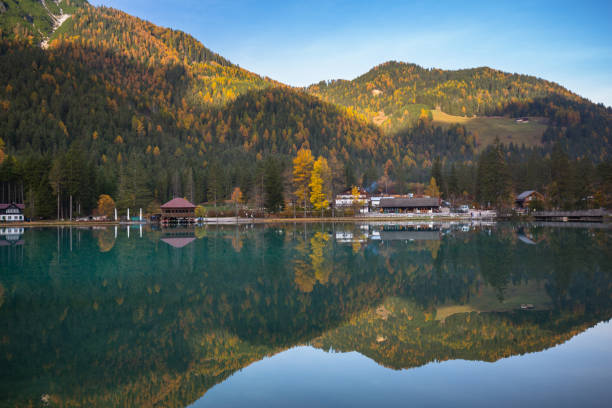 istock Dolomites mountains with reflection in Lago di Dobbiaca lake at autumn 1195180498