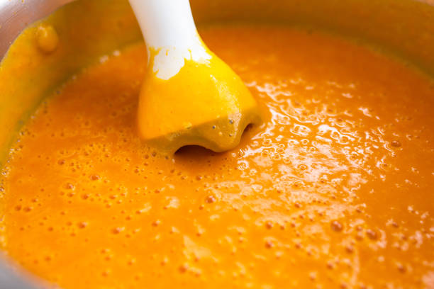 istock Blender in a pot with pumpkin soup 1195181564
