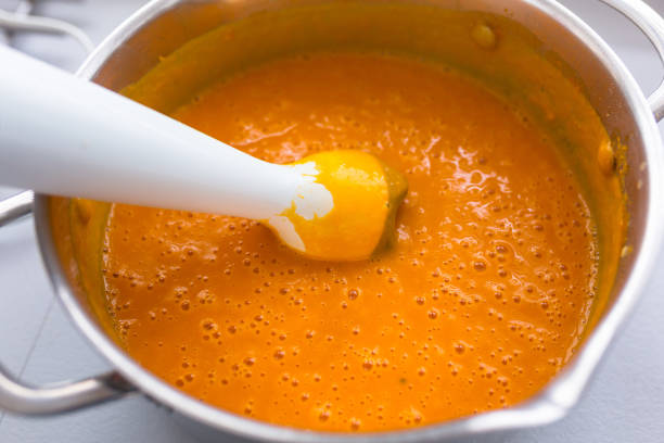 istock Blender in a pot with pumpkin soup 1195181690