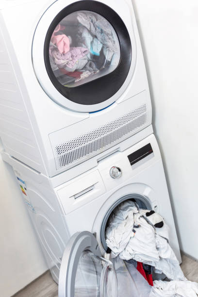 istock Electric dryer with clothes inside 1195184769