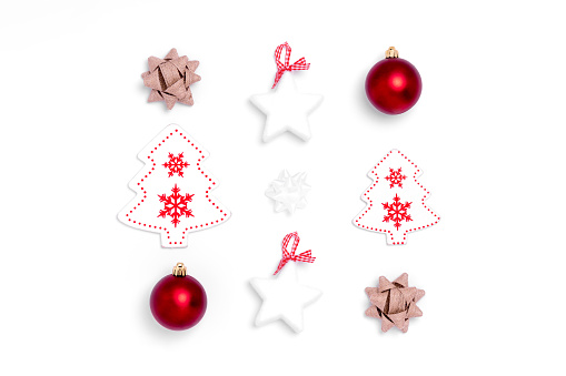 New Year and Christmas composition from red balls, white stars, chrismas tree, deer on white paper background. Top view, flat lay, copy space, square, instagram, from above