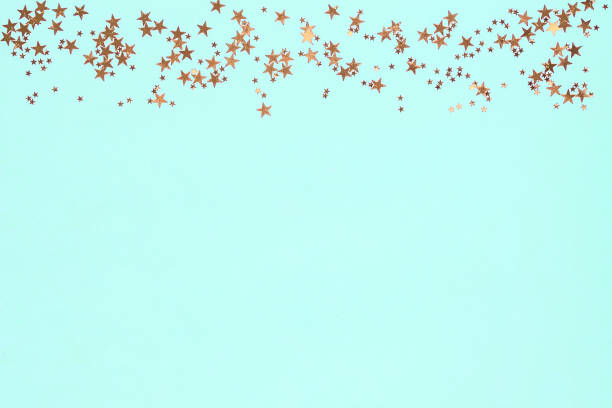 istock Frame from golden stars glitter confetti on blue background. Festive backdrop. 1195184916