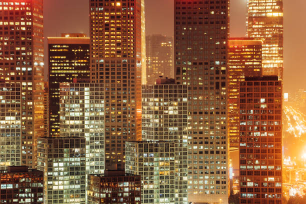 istock facade of modern office buildings at night 1195188746