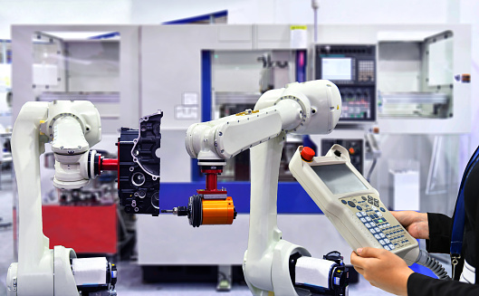 Engineer check and control automation white Modern Robot system in factory, Industry Robot concept .