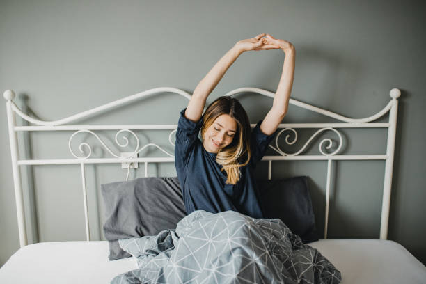 istock Young woman is waking up 1195191204