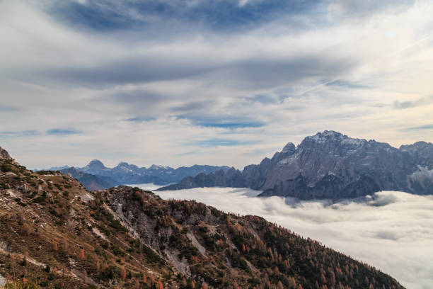 istock Cloudy autumn day in the italian alps 1195191796