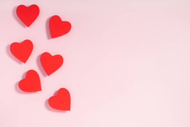 istock Valentine's day frame composition. Red hearts on pastel pink background. Top view, flat lay, copy space 1195192029