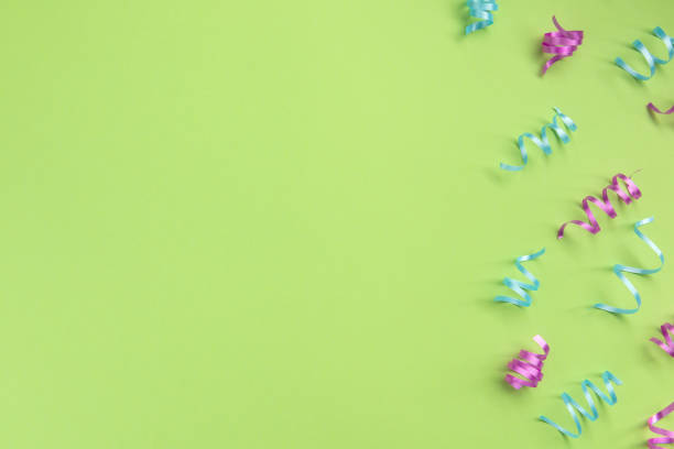 istock Serpentine on green  background. Celebration concept .Flat lay, top view, copy space. 1195192163