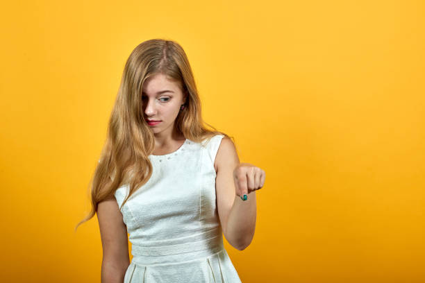 istock Charming caucasian young lady keeping finger, looking dissatisfaction 1195195327