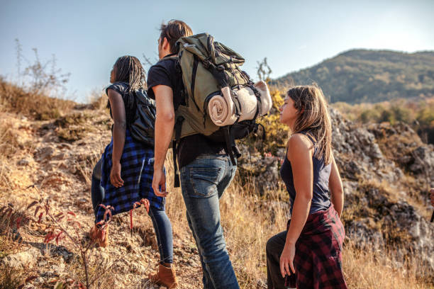 istock Friends hiking together at summer time. 1195196616