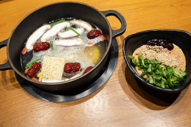 Traditional Chinese hotpot with condiments