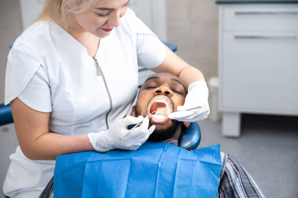 istock Young african-american man visiting dentist's office 1195201913