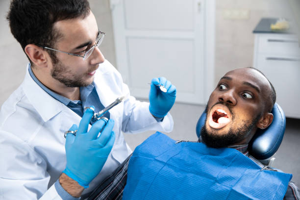 istock Young african-american man visiting dentist's office 1195201969