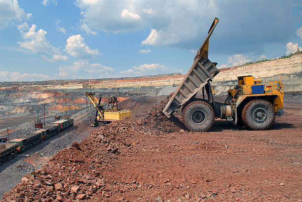 istock Dump-body truck unloading in mine 119520301