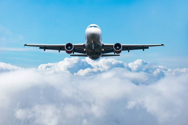 istock Flight of the passenger plane above the clouds. 1195203252