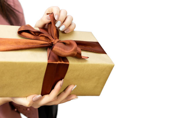istock Female hands with a gift box. 1195204125