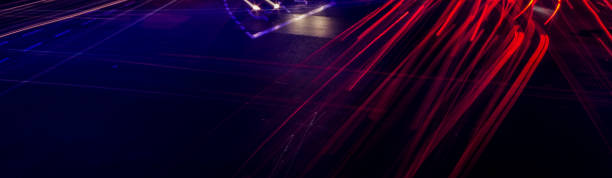 istock Crowded car tail light trails in a mess at cross road busy traffic 1195206295
