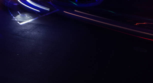 istock Car light trails at road turn line mark with black copy space 1195206307