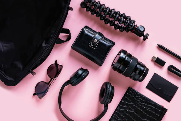 istock Stylish black accessories and modern gadgets on pink background, top view with copyspace 1195206416