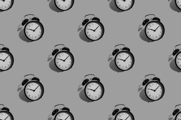 istock Many black classic style alarm clock isolated on background 1195206434