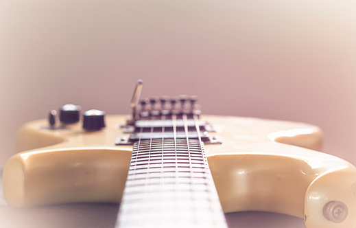 Electric guitar stratocaster sunburst closeup, macro abstract