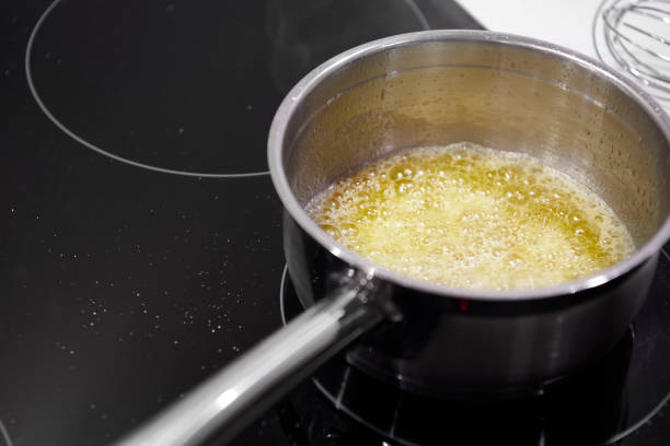 istock Butter in a pot on the hob 1195213659