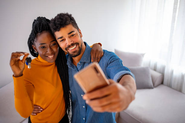 istock Young couple moving into new home 1195227343