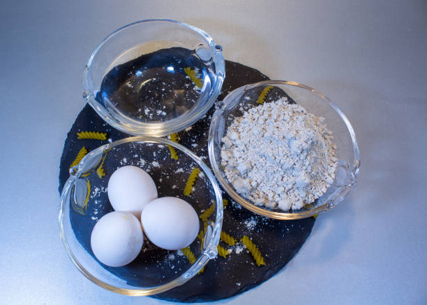 istock Gluten-free flour, eggs and water for pasta dough 1195227425