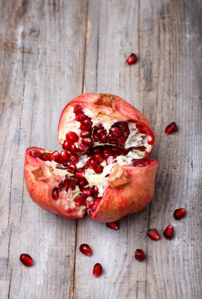 istock ripe garnet with walnuts  on a rustic wooden background 1195229303