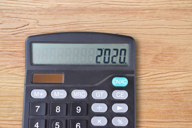 istock New year 2020 on a display of the calculator. 1195231059