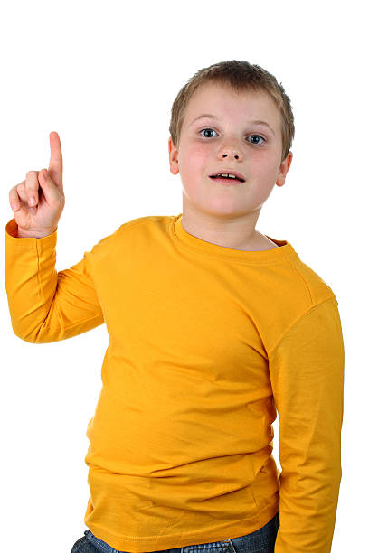 istock Delighted young boy points his finger up isolated on white 119523183