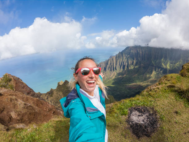 istock Woman hiking in Hawaii taking selfie 1195231981