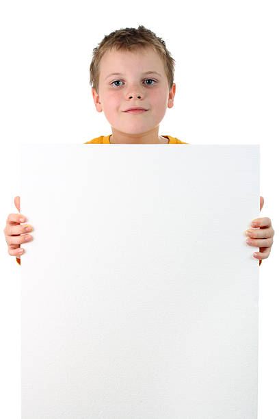 istock Small boy holds blank polystyrene banner isolated on white background 119523240