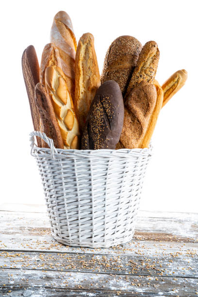 sortimento da baguete na cesta branca - carbohydrate artisan bread isolated on white isolated - fotografias e filmes do acervo