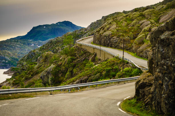 istock Road winding in mountains Norway 1195236636