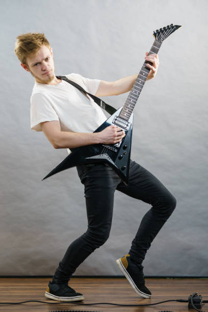 istock Man playing on electric guitar 1195239130