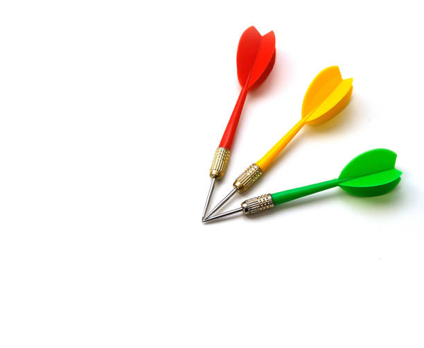 istock red, green and yellow colored dart arrow, on white ground, 1195240568