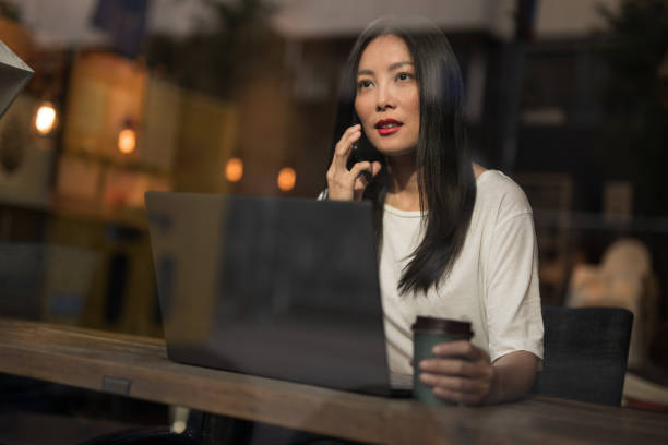 istock Pretty woman talking on mobile phone 1195240874